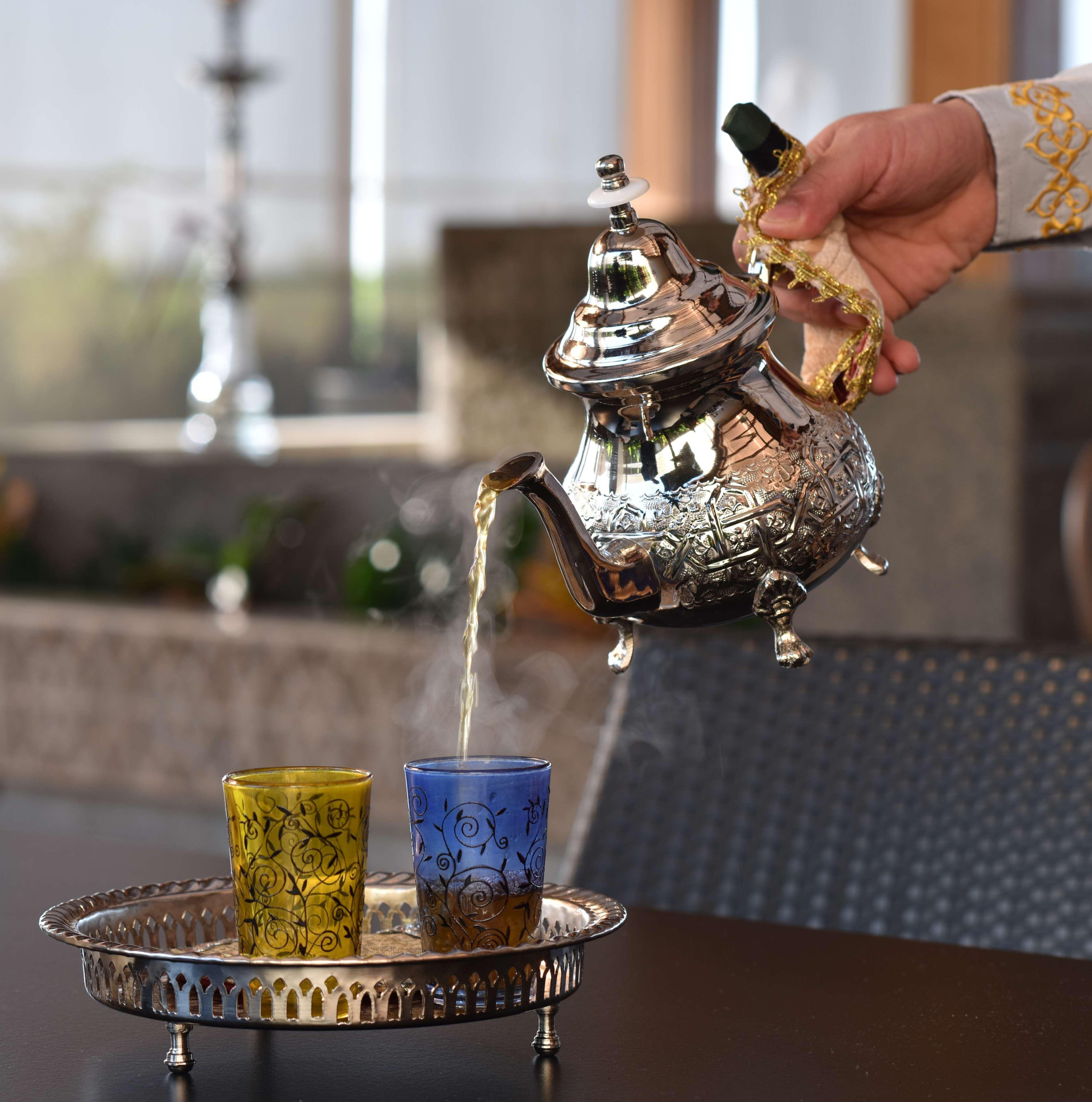 Ayla Grand Hotel Al Ain Exterior photo Moroccan tea being poured