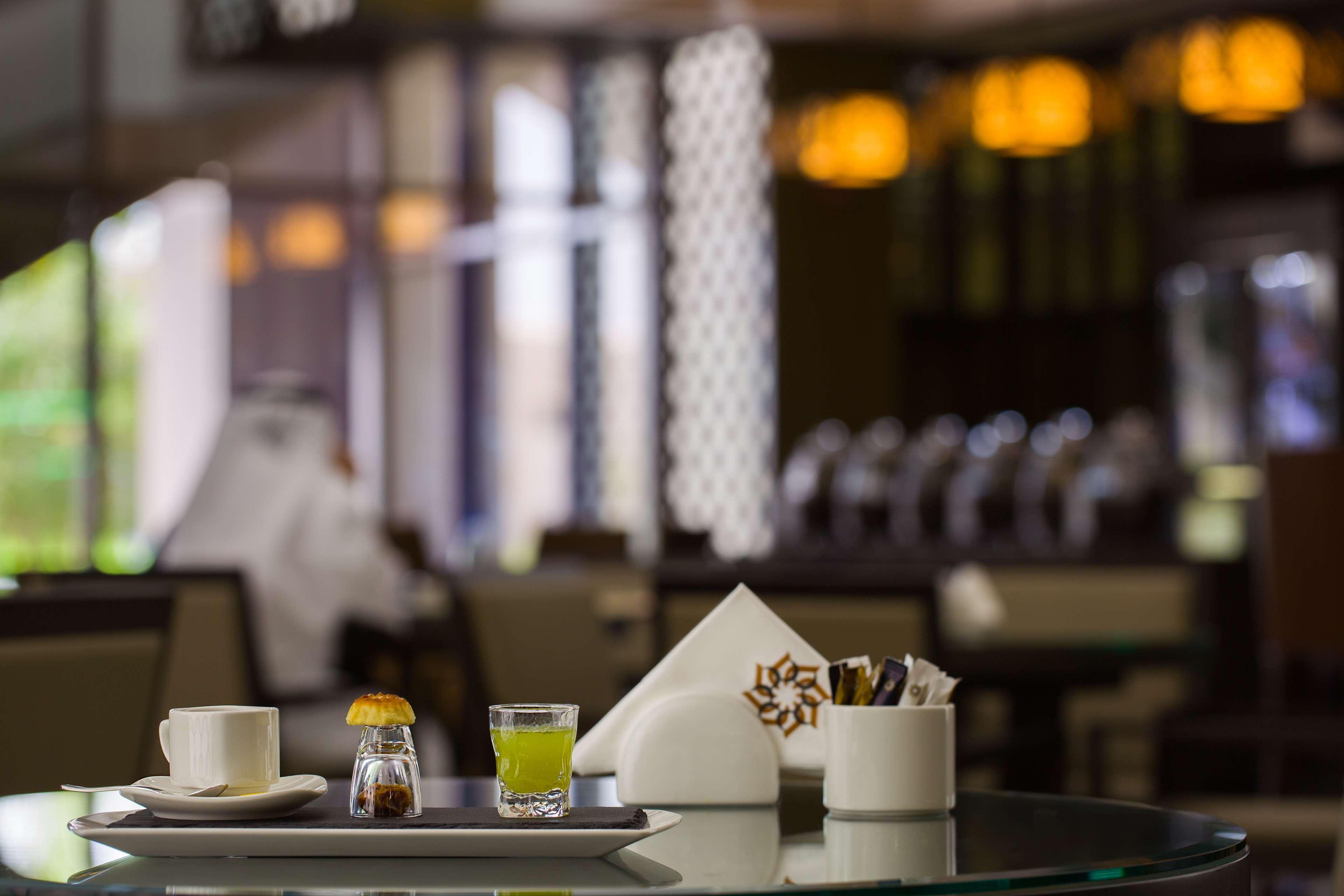 Ayla Grand Hotel Al Ain Exterior photo A table set for service