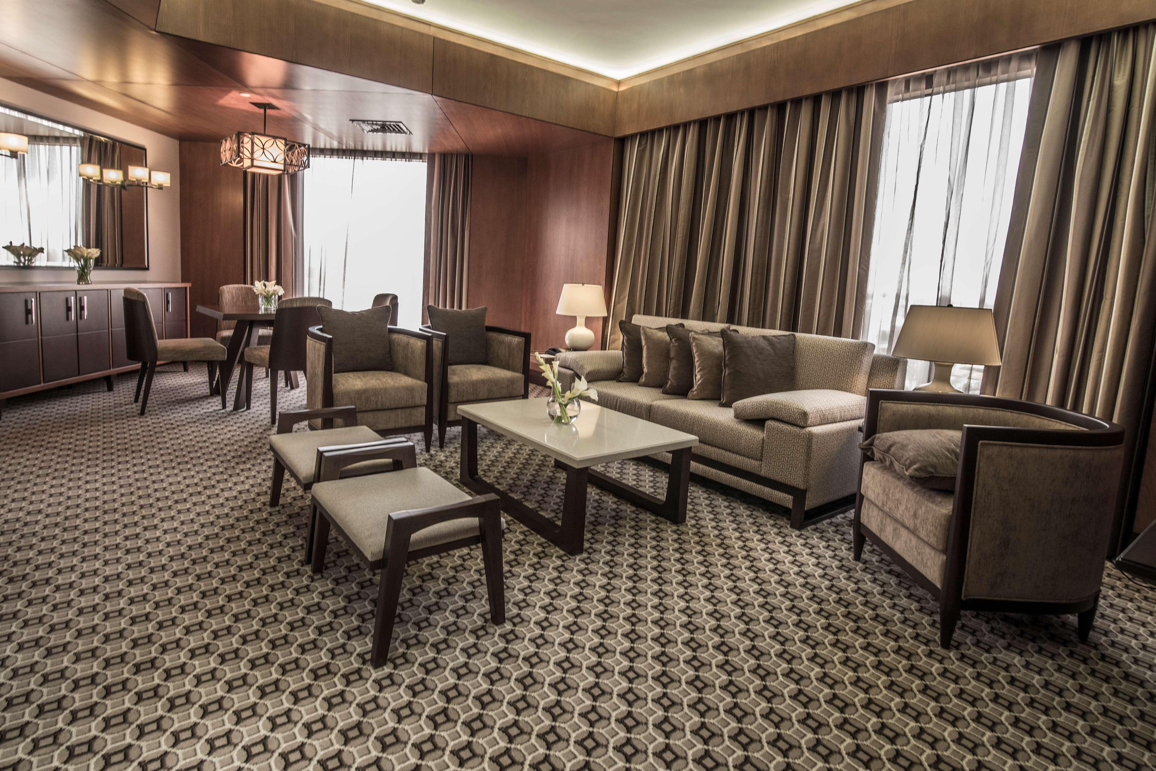 Ayla Grand Hotel Al Ain Exterior photo The interior of a suite at the hotel